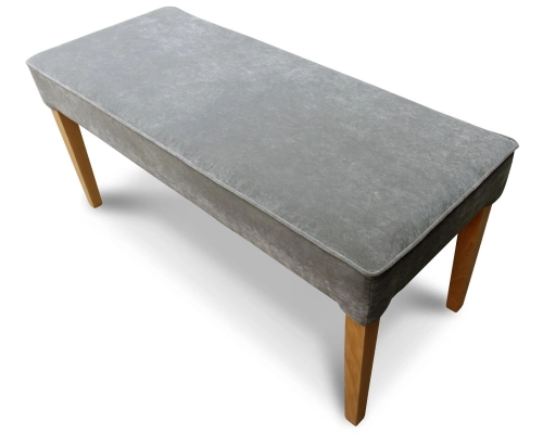 Pufa wąska z siedziskiem gładkim, niepikowanym z lamówką na obrzeżach